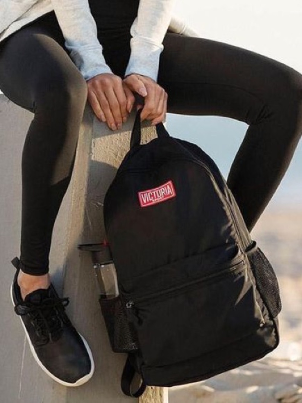 Victoria’s Secret Sport nylon black backpack with the red and white rubber logo
